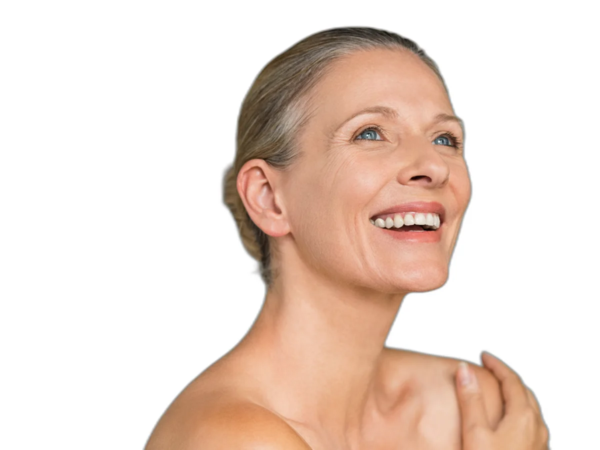 Smiling woman in her fifties with a hand on her shoulder — anti-aging and energy
